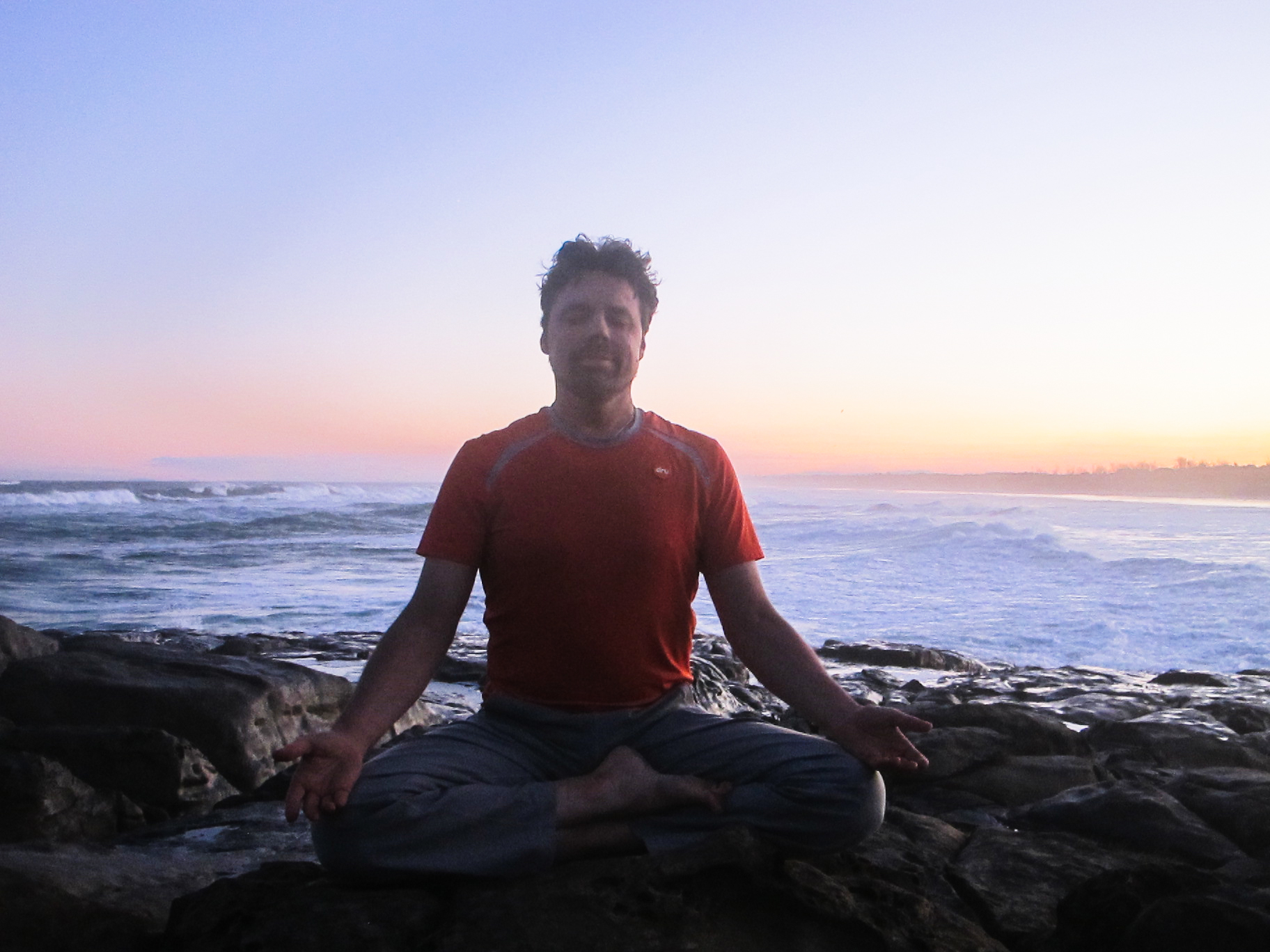Andrew meditating by sea